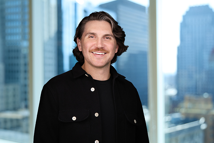 A professional headshot of Zach Allia, Chief Technology Officer at Autura