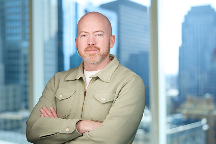 A professional headshot of Bryan Day, Chief Financial Officer at Autura