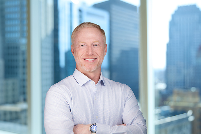 A professional headshot of Ryan Kirby, Chief Marketing Officer at Autura