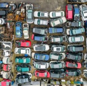 Impound auction lot with abandoned, unclaimed vehicles