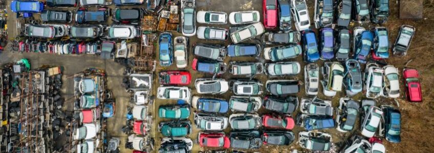 Impound auction lot with abandoned, unclaimed vehicles