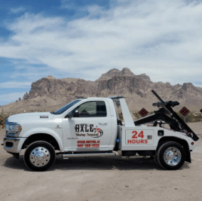 Axle Towing Tow Truck white white logo against Arizona landscape backdrop