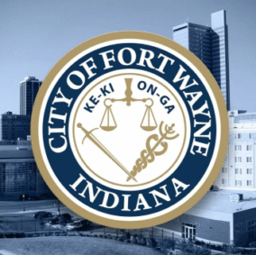 Fort Wayne, IN seal of the city against city downtown buildings