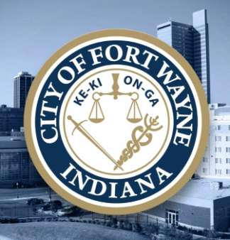Fort Wayne, IN seal of the city against city downtown buildings