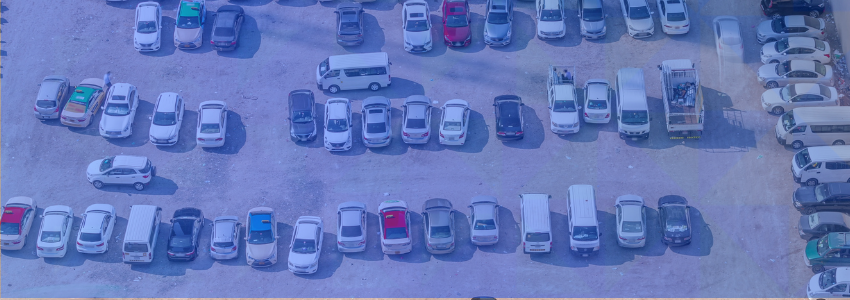 Impound lot management stories and insights feature image with multi-color vehicles on impound lot
