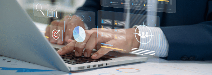 Hands typing on a laptop with overlay of towing program performance data dashboards