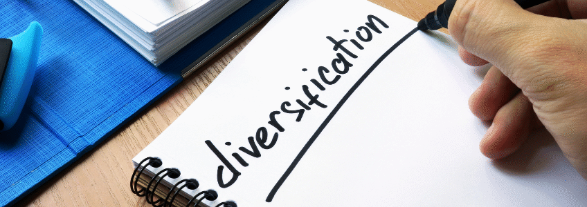 How smart towing business owners diversify revenue: hand writing the word "diversification" on a notepad