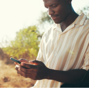 Man reviewing mobile payment options after vehicle breakdown