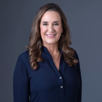 Cindy Iodice, CEO and Founder of Flagman Inc. Profile pic against grey blue background