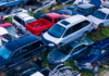 Impound yard image with multi-colored cars ready for sale on Autura Marketplace